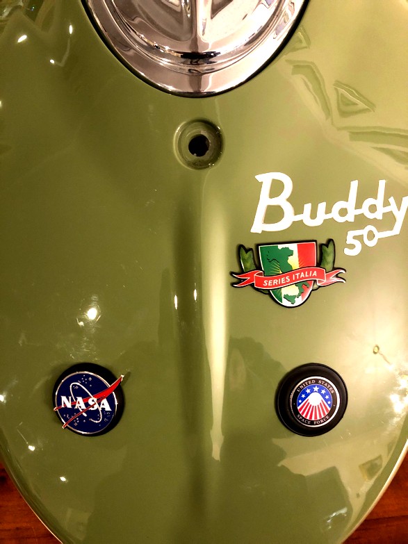 Repaired/plugged holes from front with space-themed novelty pins. Ciao bella, earthlings!