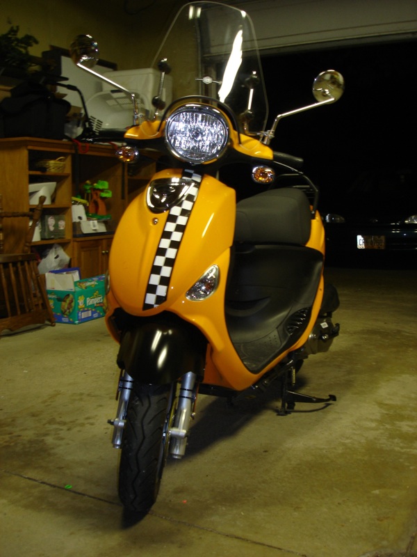 Checkered Strip on front panel. Painted front fender black. Painted passenger foot rests black. Added wind shield.