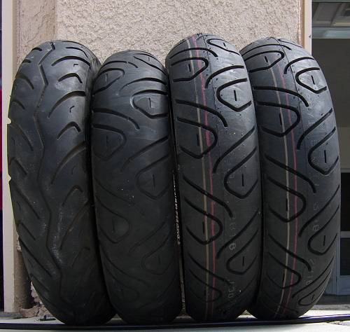 Tires, real old, old, and two new ones