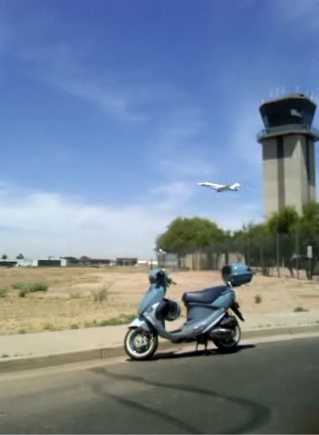 Scoot with airplane in flight (terrible quality shot....pulled the still out of a video from my phone)
