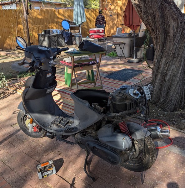 Stripping the rear end of the scoot.