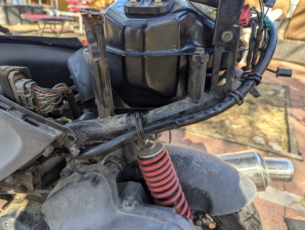 Fuel line routed along the frame.