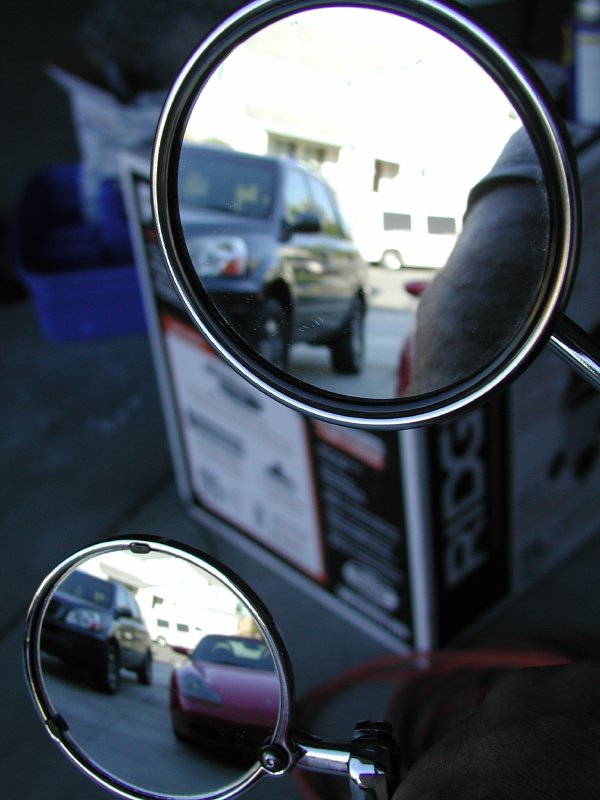 Comparison of factory and bar end mirror visibility.