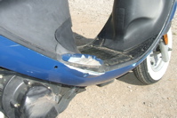 Right side is scratched all over, including the exhaust pipe.
